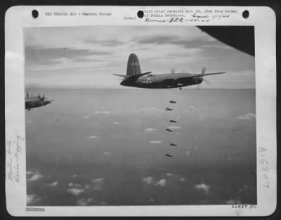 Thumbnail for Consolidated > BOMBS AWAY! Six 500-pounders start on their quick trip down to a nazi fighter airdrome in Western Europe. U.S. Marauders (B-26 medium bombers) are carrying out a continuous attack against Luftwaffe fighter facilities.