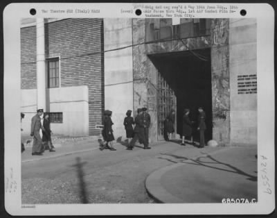 Thumbnail for Consolidated > Arriving At The 12Th Air Force Headquarters In Italy, Air Wacs Show Their Passes To Mps On Duty At The Gate And Enter The Modern Building Where They Work.