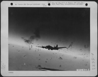 Thumbnail for Consolidated > Bursts Of Deadly Flak Explode Around A Boeing B-17 "Flying Fortress" Of The 381St Bomb Group, En Route To Bomb Enemy Installations In Europe.  The Flak Appears As Innocent Puffs Of Smoke, But Each Burst Showers Approximately 1400 Jagged Pieces Of Metal At