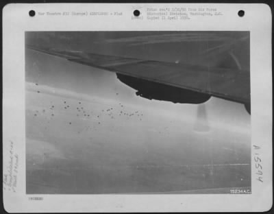 Consolidated > What Appear To Be Harmless Puffs Of Smoke Against The Sky Are In Reality Deadly Flak Bursts Encountered By Consolidated B-24S Of The 392Nd Bomb Group While En Route To Bomb An Enemy Target Somewhere In Europe.  10 August 1943.