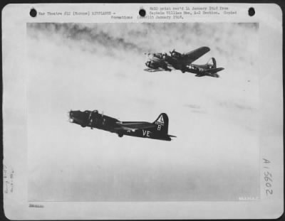 Thumbnail for Consolidated > Boeing B-17 Flying Fortresses Of The 381St Bomb Group, Flying Through Dense Clouds While En Route To Bomb Enemy Installations Somewhere In Europe.  These Fortresses Are Stationed At An Airbase In England.