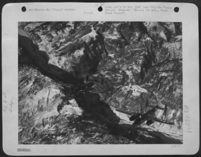 Thumbnail for Consolidated > With Snow Covered Mountains Obscuring The Bomb Strikes They Just Caused, These North American B-25 Mitchells Of The 12Th Af Complete Another Day'S Work In Northern Italy.  This Attack Was On 18 January 1945 At A Bridge Along The Brenner Line Near The Aust