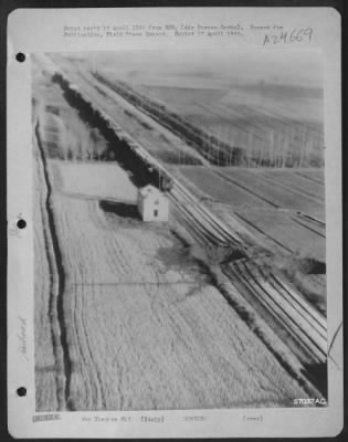 Thumbnail for Consolidated > End Of The Road -- A Stop Sign Posted By A 12Th Air Force Republic P-47 Thunderbolt [Thunderbomber] 15 Miles West Of Milan, Italy.  Nazi Repair Crews Are Hopelessly Incapable Of Bridging All The Stop-Gaps Placed In The Path Of Badly Needed Supplies.