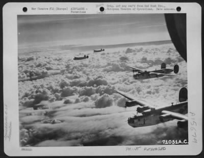 Thumbnail for Consolidated > A Formation Of Consolidated B-24 Liberators Of The 2Nd Bomb Division, Flies Over A Blanket Of Clouds En Route To Bomb Enemy Installations Somewhere In Europe.  24 November 1944.