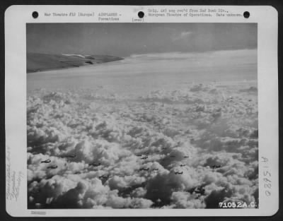 Thumbnail for Consolidated > A Formation Of Consolidated B-24 Liberators Of The 2Nd Bomb Division, Flies Over The Fleecy Clouds That Hide The Countryside Below As They Wing Their Way To Bomb Enemy Installations Somewhere In Europe.  24 November 1944.