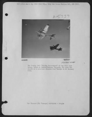 Consolidated > Two Boeing B-17 "Flying  Fortresses" Of The 91St Bomb Group, Based At Bassingbourne, England, Fly Over The Clouds On A Practice Mission Over Europe On 28 January 1944.