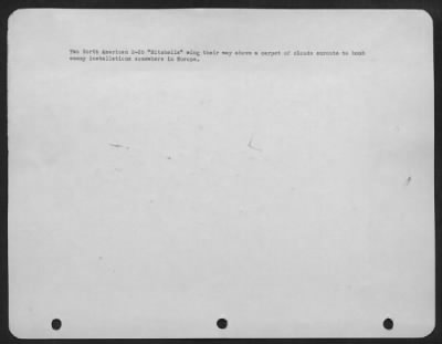 Consolidated > Two North American B-25 'Mitchells' Wing Their Way Above A Carpet Of Clouds Enroute To Bomb Enemy Installatioin Sonewhere In Europe.