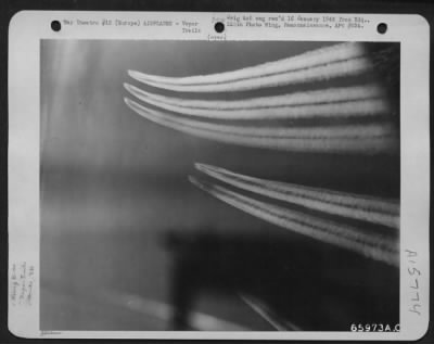 Thumbnail for Consolidated > Barely Visible, These Boeing B-17 Flying Fortresses Of The 381St Bomb Group Leave Wispy Vapor Tails As The Only Evidence Of Their Passing, En Route To Bomb Nazi Installations, Somewhere In Europe.