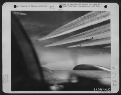 Thumbnail for Consolidated > Boeing B-17 Flying Fortresses Of The 381St Bomb Group En Route To Attack Enemy Installations Somewhere In Europe, Leave Fleecy Vapor Trails In Their Wake.