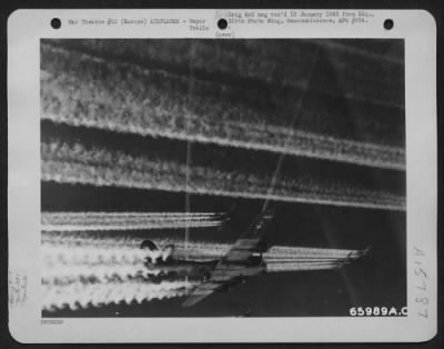 Thumbnail for Consolidated > Boeing B-17 Flying Fortresses Of The 381St Bomb Group, Leave Another Lane Of Vapor Trails To Those Left By A Preceding Formation, En Route To Bomb Enemy Installations Somewhere In Europe.