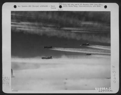 Thumbnail for Consolidated > Boeing B-17 Flying Fortresses Of The 381St Bomb Group Leave Streams Of Condensing Vapor As They Roar Steadily On Toward Their Objective - An Enemy Installation Somewhere In Europe.