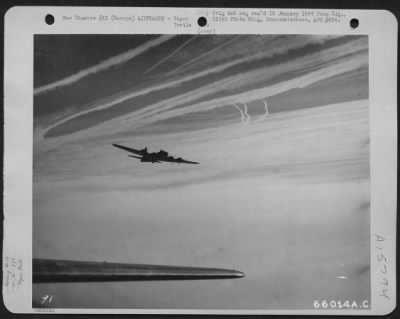 Thumbnail for Consolidated > Boeing B-17 Flying Fortresses Of The 381St Bomb Group En Route To Bomb Enemy Installations In Europe, 13 December 1944, Leave Vapor Trails In The Sky.