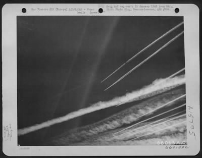 Thumbnail for Consolidated > Boeing B-17 Flying Fortresses Of The 381St Bomb Group En Route To Bomb Enemy Installations In Europe, 13 December 1944, Leave Vapor Trails In The Sky.