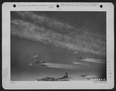 Thumbnail for Consolidated > Boeing B-17 Flying Fortresses Of The 381St Bomb Group En Route To Bomb Enemy Installations In Europe Leave Vapor Trails In The Sky.  Note Flak Bursting Around Planes.