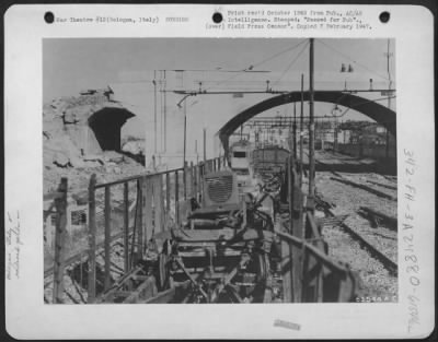 Thumbnail for Consolidated > This Po River Target Was The Rail Yards At Bologna, Italy, Attacked By Planes Of The Mediterranean Allied Air Forces.  An Arch Of The Mascarella Footbridge Was Destroyed, And A Line Of Railroad Cars Loaded With German Equipment Burned And Wrecked.