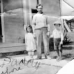 Thumbnail for Vic Sr., Joe & Adeline in front of house