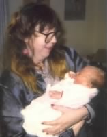 Thumbnail for Mom Holding 1st Grandchild, my son