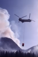 Thumbnail for Helicopter using a river water to douse fire