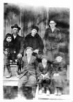 senior duvall & fam on porch of lease house.jpg