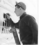 Thumbnail for T/Sgt Fred Lawrence, CREW CHIEF, Painting BOMBS (Missions) on his Ship./ Corsica