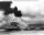 Thumbnail for 8_USS Maryland and Capsized USS Oklahoma_07Dec1941.jpg