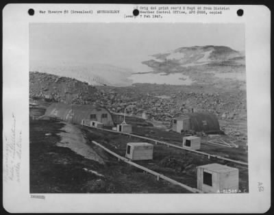 Thumbnail for General > View Of Cape Adelaer, Greenland.  Warehouse On The Left And On The Right Is Rescue House Of 1943-1944 Bicd Installation.  In The Foreground May Be Seen Doghouses.  Water For Camp Is Normally Obtained From Stream Running To Right Of Rescue House.  The Stre