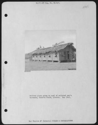 Thumbnail for General > Natives Place Palms On Roof Of Enlisted Men'S Barracks, Roberts Field, Liberia.  May 1943.