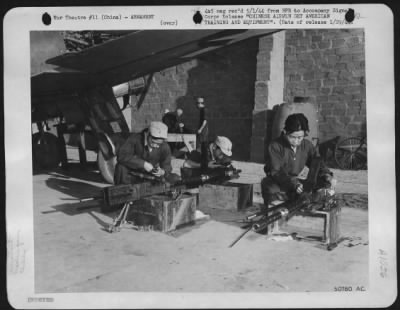 General > Members of Chinese ground crews are careful and thorough in cleaning 50 cal., machine guns. In foreground, left to right: Sgts. Huang Wan-Yi, Liu-Han-tao, and Toeng Tac-Han.