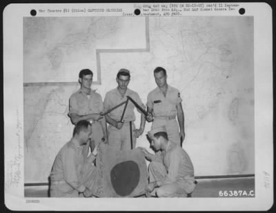 Thumbnail for General > Major J.R. Fawcett And Capt. N.W. Mcdivitt Of The 462Nd Bomb Group Hold A Jap Flag That Was Brought Out Of Burma By Three Enlisted Men Who Had Walked Back To The Boeing B-29 Base In China After Bailing Out Of A Burning Plane Over Burma.  They Are (Back Ro