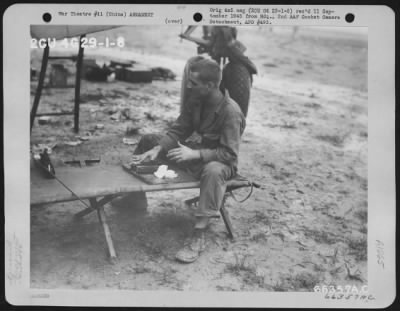 Thumbnail for General > S/Sgt. John L. Austin, Shreveport, La., Cleaning The Bolt And Oil Buffer Assembly Of One Of The Two 50-Cal. Machine Guns Of The Lower Forward Turret Of A Boeing B-29 Of The 444Th Bomb Group, Xx Bomber Command, After A Raid On Japanese Industries In Anshan