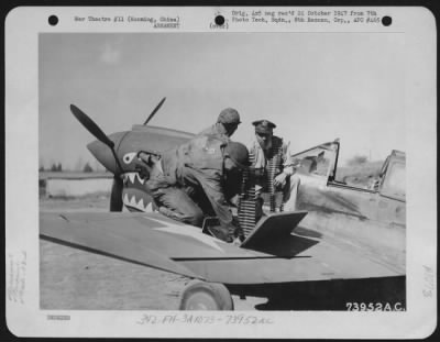 General > Colonel Robert L. Scott, Jr. (Macon, Georgia) Of The 23Rd Fighter Group, Helps S/Sgt. R. Fuller Of Texas And Sgt. J. Teague Of La Follette, Tennessee, Load His Guns Prior To Colonel Scott'S Final Jap Hunt Before Leaving Kunming, China For The United State