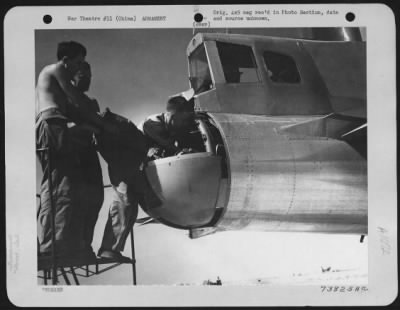 General > Armorers Install A Gun In The Tail Component Of A Boeing B-29 "Superfortress" At An Air Base In China.