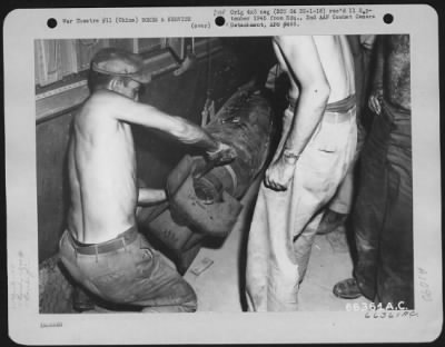 Thumbnail for General > Before Leaving On Mission 9 To Ashan, Manchuria A Boeing B-29 With The 40Th Bomb Group, Xx Bomber Command, Has Crew Members Attaching Fin To One Of Its 500-Lb. Bombs.  Fin Keeps Bomb On Course.  China.