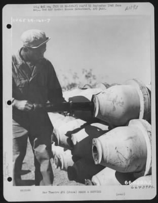 Thumbnail for General > The M-5 Igniter Inserted Into The Burster Well Of A M-76 500 Pound Incendiary Bomb, Making Certain That The Pipe Lugs Of The Igniter Are To The Rear.  China.