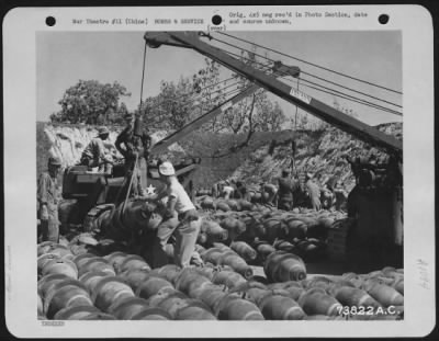 Thumbnail for General > With The Use Of A Crane, Bombs Are Stacked Neatly At An Air Base In China.  10 May 1944.