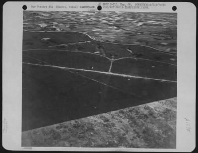 Thumbnail for General > This Reconnaissance Photograph Taken On July 22, 1945 Shows Planes In Revetments, And The Painted Camouflage On A Section Of A Runway At White Cloud Airfield, Canton, China.