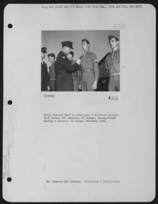 Thumbnail for Awards > Brig. General Earl S. Hoag Pins A Citation On Sgt. Paul Bowen, Atc Mechanic Of Sermyn, Pennsylvania During A Ceremony In China, February 1944.