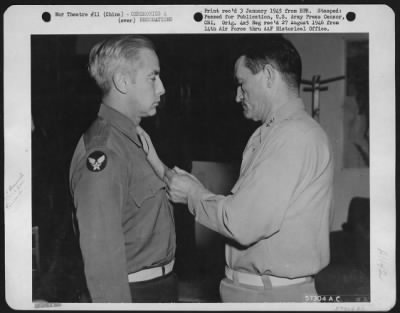 Thumbnail for Awards > Brig. General Russell E. Randall Of Merrick, N.Y., Is Shown Being Presented The Distinguished Flying Cross And Oak Leaf Cluster For His Air Medal, By Major General C.L. Chennault, Commanding General Of The 14Th Air Force, China.  The Flying Cross Was Awar