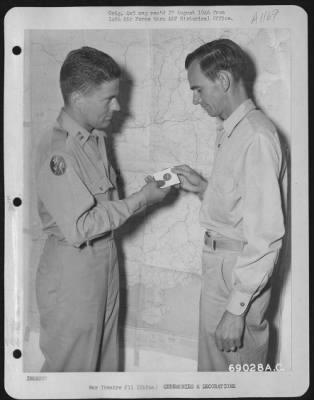 Thumbnail for Awards > Capt. Charles L. Hannon And T/Sgt. Robert G. Tracewell Admire The Chinese Award Presented To The 14Th Air Force In Chungking, China On 11 October 1945.