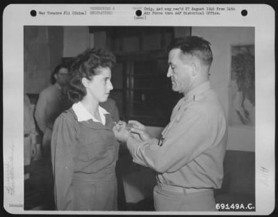 Thumbnail for Awards > "For Meritorious Achievement In Aerial Flight" Lt. Florence T. Roche, Of Hempstead, New York, An Army Nurse Attached To A Air Evacuation Squadron Of The 14Th Air Force, Was Awarded The Air Medal From Major General Claire L. Chennault During A Brief Ceremo