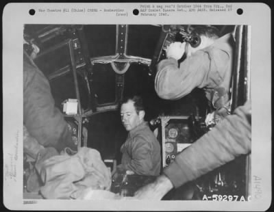 Thumbnail for Bombardier > 1st Lt. Marshall H. Norton of San Antonio, Texas, a bombardier with the 45th Bomb Squadron, 40th Bomb Group, 20th Bomber Command, at his position in a Boeing B-29 in China.