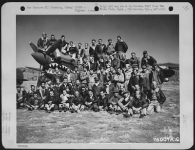 Fighter > Officers And Enlisted Men Of The 74Th Fighter Squadron, 23Rd Fighter Group, Pose On And By A Curtis P-40 At Kunming, China.  1 February 1943.  They Are: Officers: Lts: Ladd, Mitchell, Crysler, Jones, Hawkings, Anderson, Bunch, Wanner, Turner, Morrison, Lu