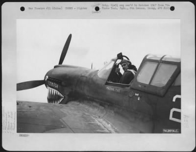 Fighter > Major Hal Pike Of The 16Th Fighter Squadron, 51St Fighter Group, Seated In The Cockpit Of His Curtiss P-40 "Flyin' Fish" Prior To Giving The Take-Offi Signal.  Peishihwa, China, 22 October 1942.