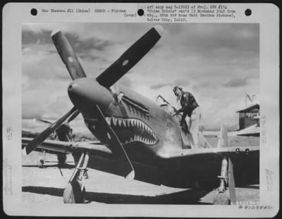 Thumbnail for Fighter > Colonel David 'Tex' Hill Of Hunt, Texas, Air Ace Of The 'Flying Tigers' Gets Into His Plane Just Before Take Off On A Mission From His Base Somewhere In China. 2 Oct. 45.