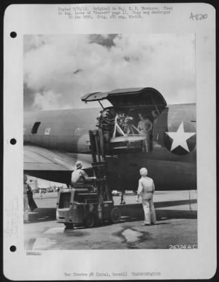 Thumbnail for General > An engine is placed on board a freight transport bound west, for overhaul.  Natal, Brazil.