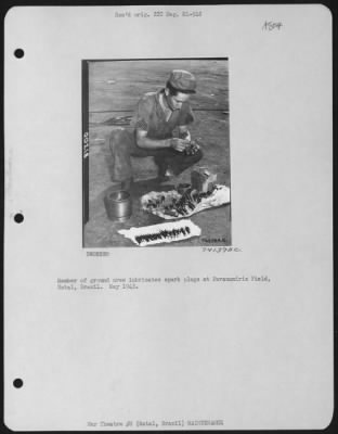 Thumbnail for General > Member Of Ground Crew Lubricates Spakr Plugs At Parnamirim Field, Natal, Brazil.  May 1943.