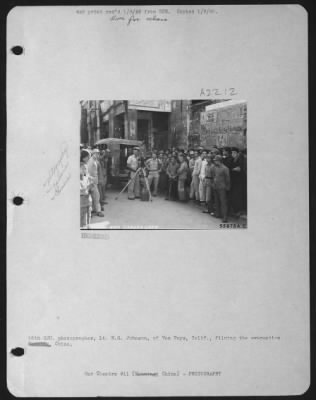 Thumbnail for Motion Pictures > 16th CCU. Photographer, Lt. H.G. Johnson, of Van Nuys, Calif., filming the evacuation. Nanning, China.