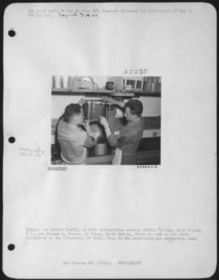 Thumbnail for Processing > T/Sgts. Joe Martin (left), of 6398 Metropolitan Avenue, Middle Village, Long Island, N.Y., and Norman S. Turner, of Ethan, South Dakota, shown at work in the photo laboratory of the Liberators of China. They do the developing and projection work.