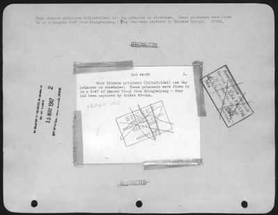 Thumbnail for General > four Chinese prisoners (blindfolded) one Jap prisoner on stretcher. These prisoners were flown in on a Douglas C-47 from Shingbwiyang.-They had been captured by Chinese troops. CHINA.