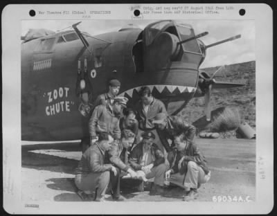 General > The Pilot Of The Consolidated B-24 "Zoot Chute" Briefs His Crew Prior To Take-Off On A Mission From A 14Th Air Force Base In China.